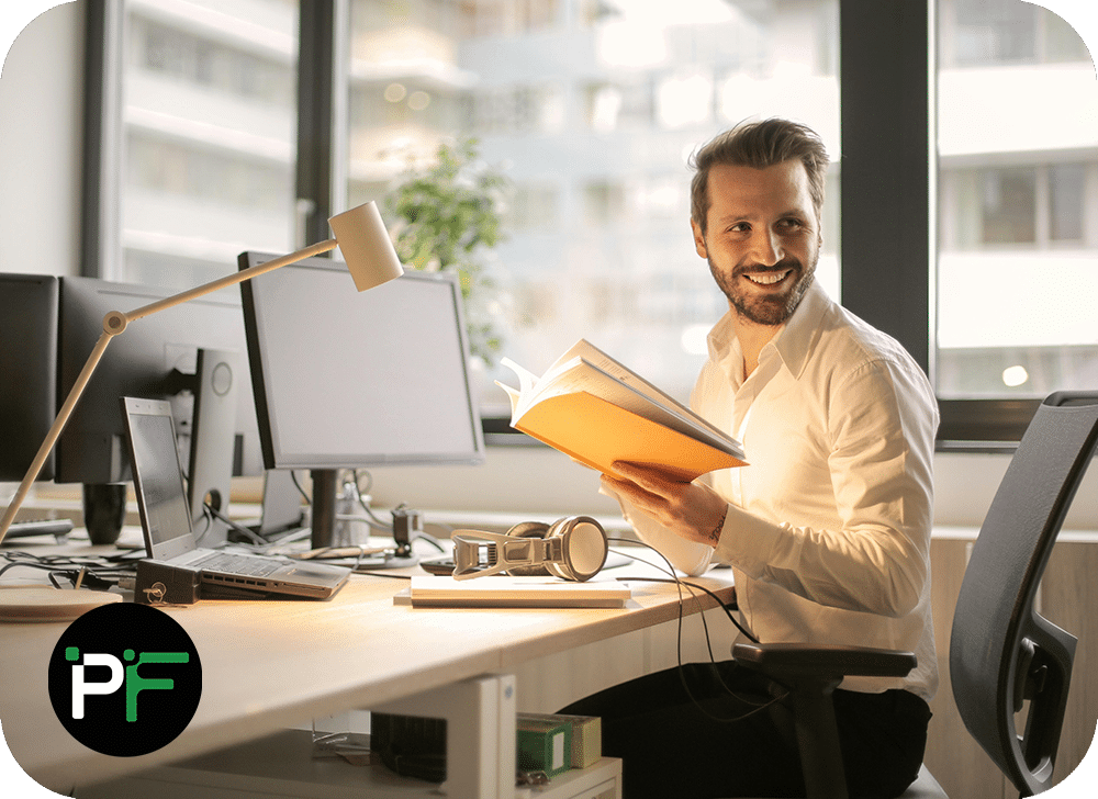 A professional reviewing business insights on a laptop, highlighting the role of Power Apps Solutions in improving workflow efficiency.