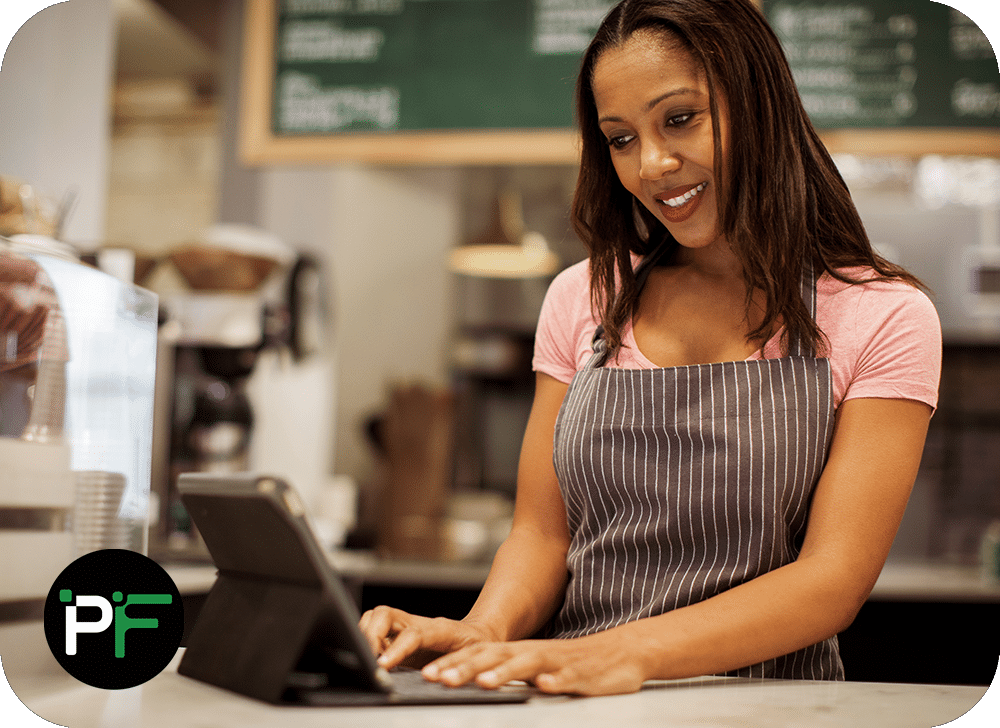 A retail professional using a tablet for business operations, illustrating the convenience and effectiveness of retail software development services.