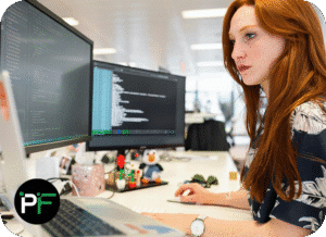 A developer working on a laptop, writing structured HTML code, representing the expertise and strategic guidance of software development consulting.
