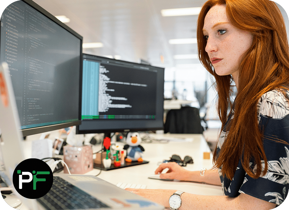 A developer working on a laptop, writing structured HTML code, representing the expertise and strategic guidance of software development consulting.