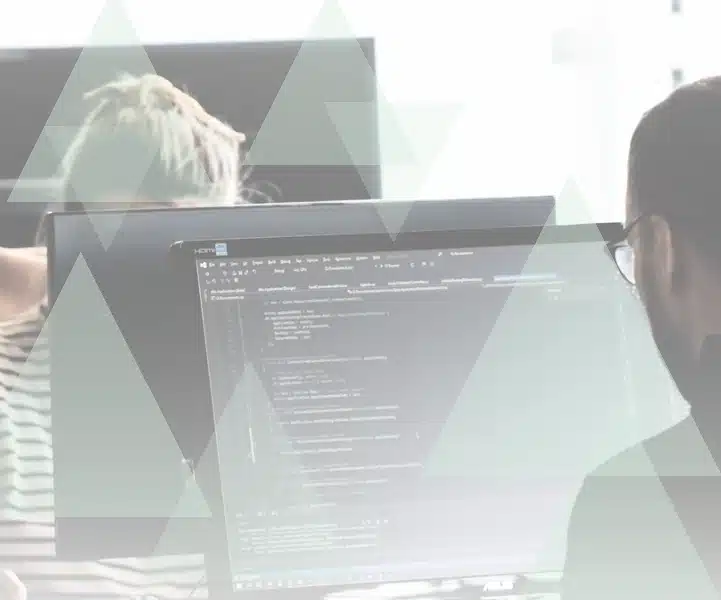 Developer writing code at a workstation